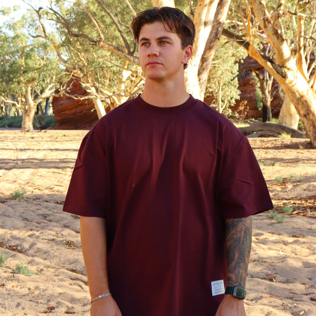 oversized tee in burgundy colour in a box style fit unisex design
